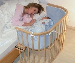 baby crib attached to bed