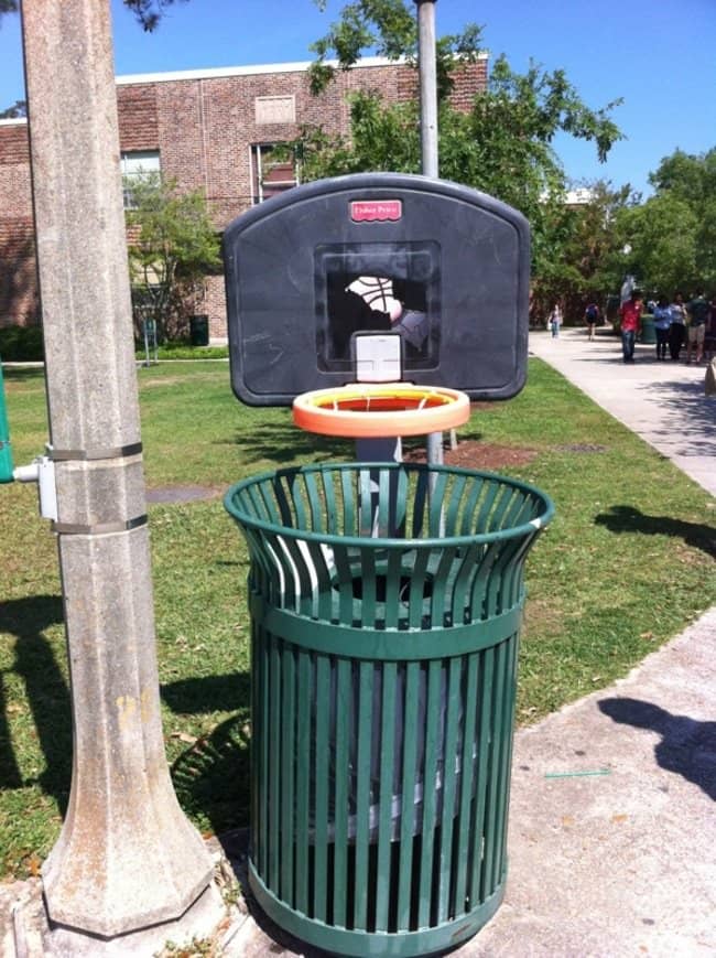 trash can with basketball hoop attached to the top