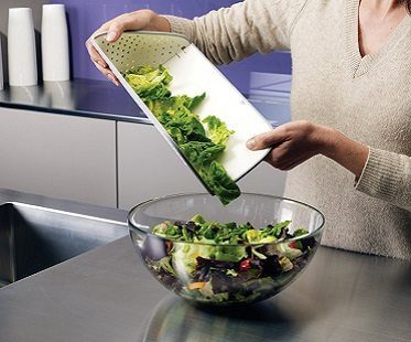 chopping board and colander salad