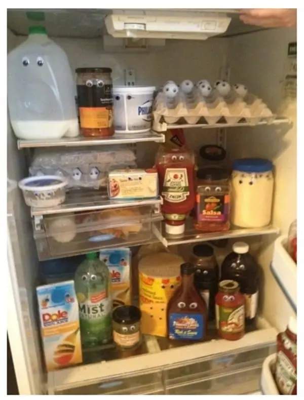 googly eyes covering fridge items 