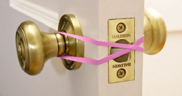 loop a rubber band to stop door locking