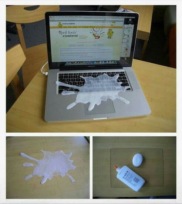 fake spilled milk over laptop craft glue