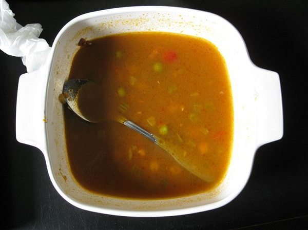 spoon submerged in soup