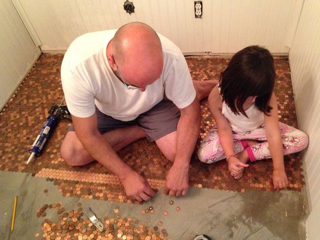 man girl laying pennies