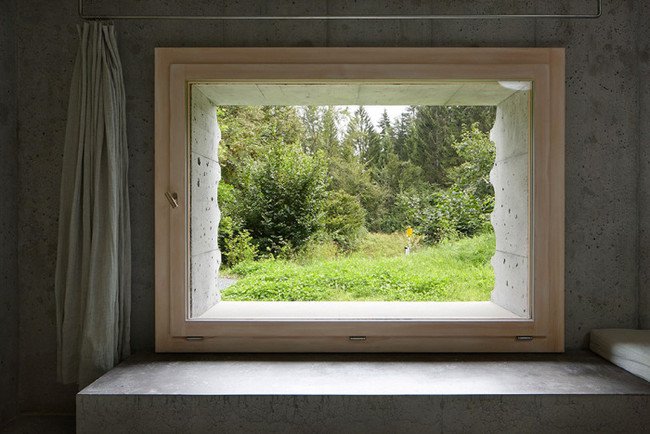 inside-concrete-log-cabin-and-view