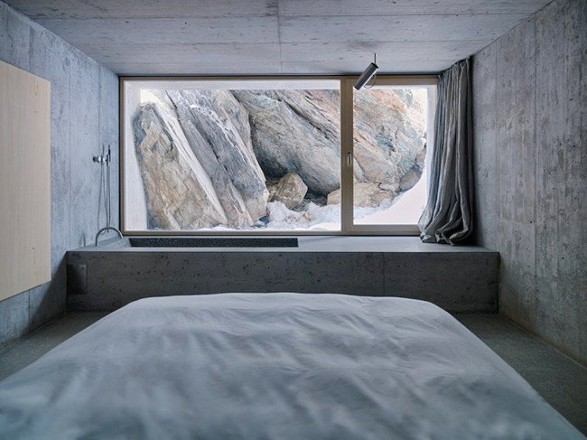 inside-concrete-log-cabin-bed