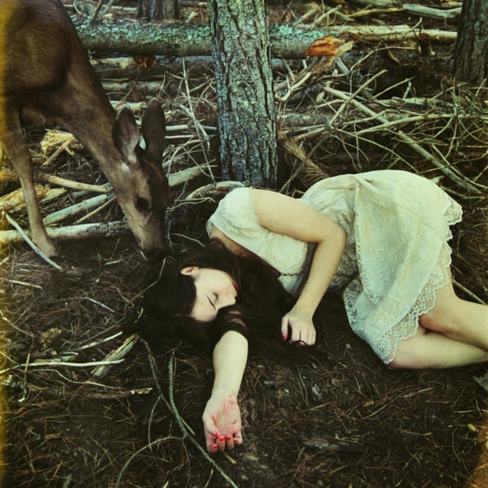 girl sleeping deer