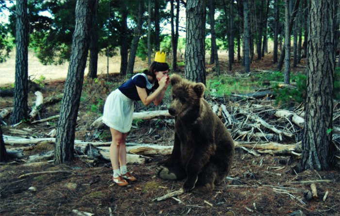 girl whispers bear