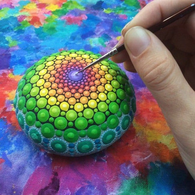 painting green mandala stone