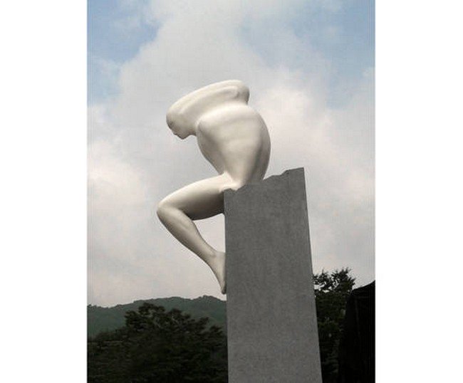 white rocking sculpture plinth