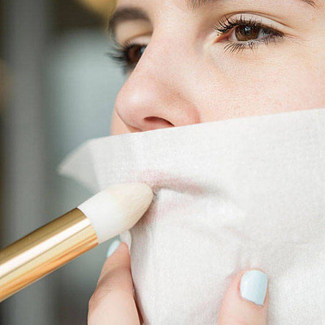 woman tissue brush mouth