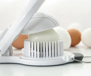 https://www.awesomeinventions.com/wp-content/uploads/2015/04/egg-slicer-and-chopper.jpg