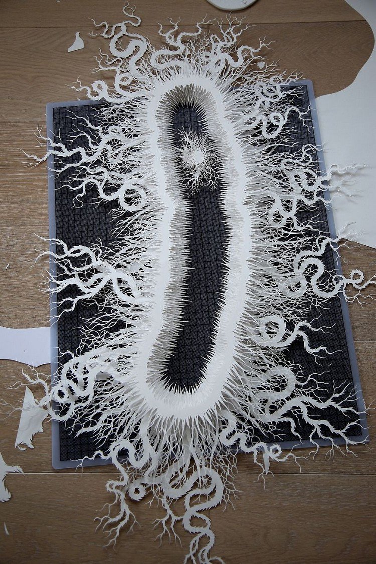 paper microbe on black mat