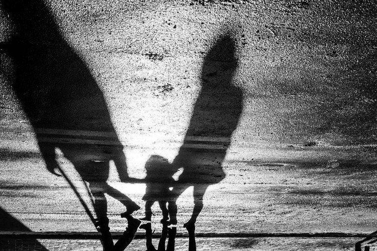 elongated shadows people