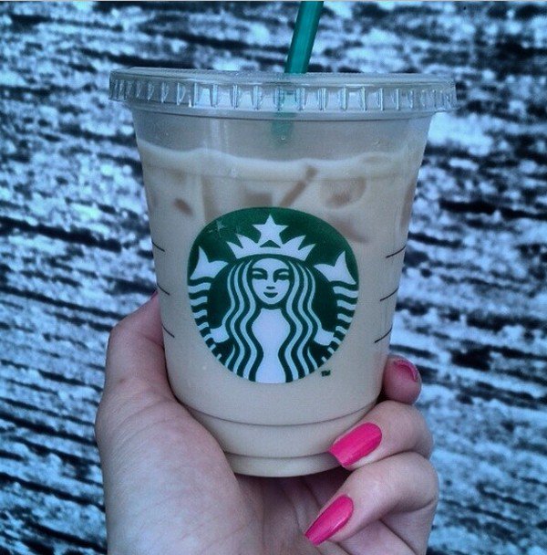 hand holding starbucks cup