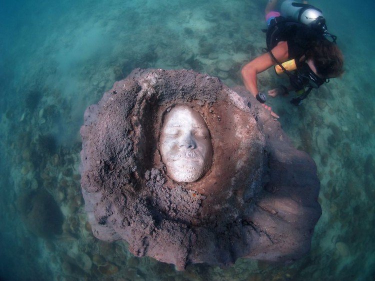 underwater sculpture face diver