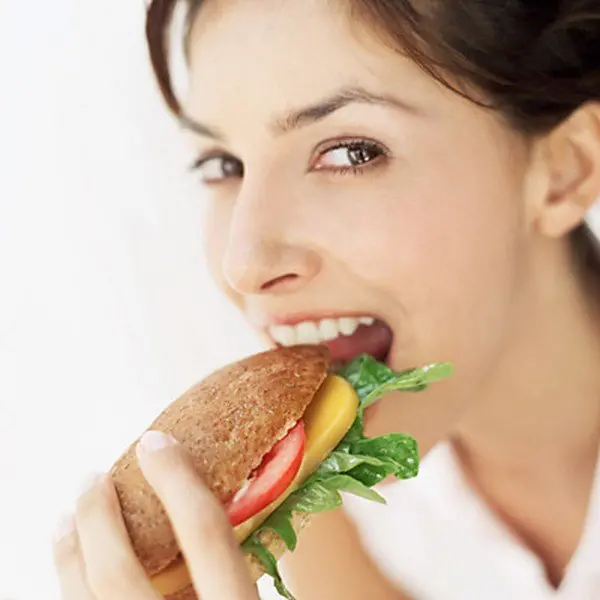 woman eating sandwich