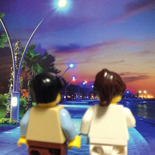 LEGO figures holding hands outside