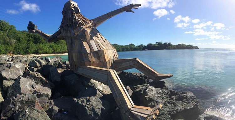 giant wood sculpture sea