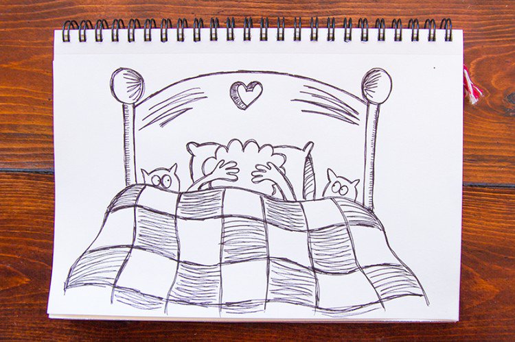 couple embracing bed cats
