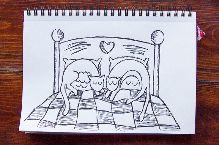 couple sleeping bed cats on head