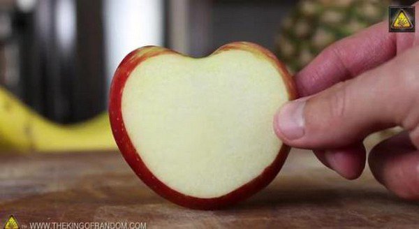 holding whole apple slice