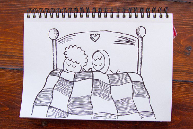 sleeping cats couple bed