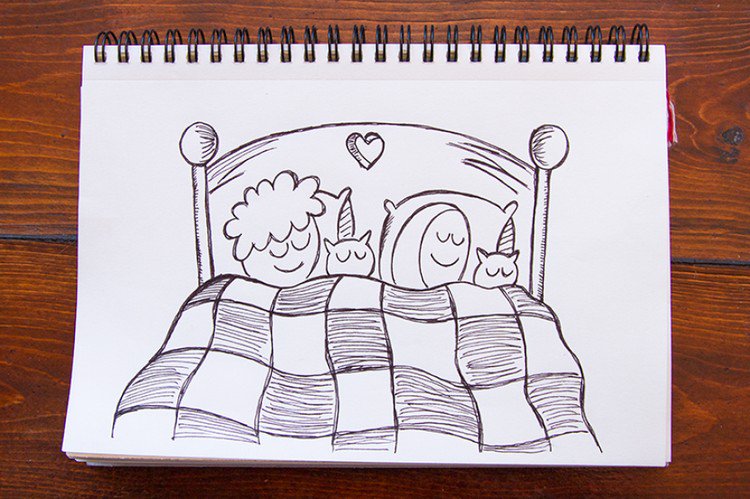 sleeping couple cats bed