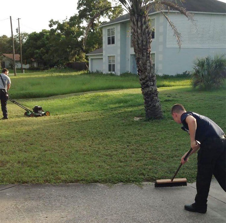 firemen mowing grass