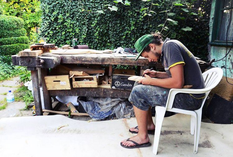 man carving outdoors