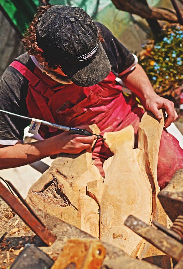 man carving