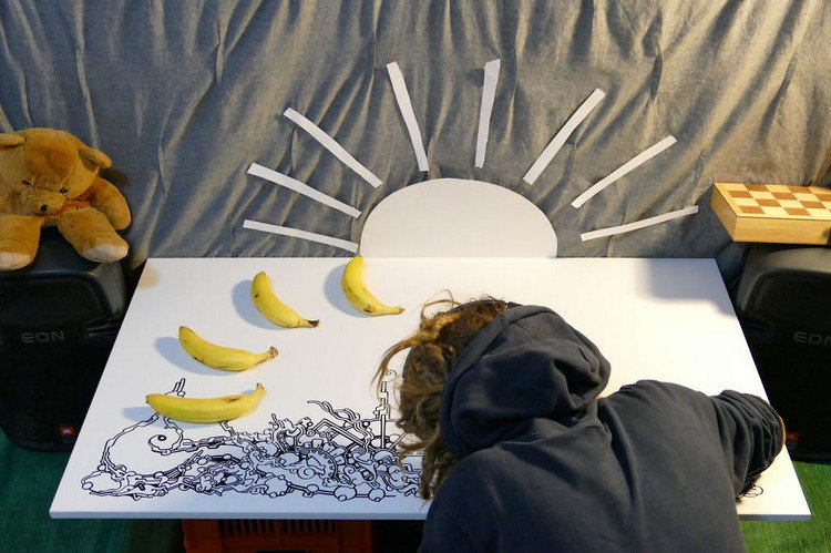 man drawing bananas