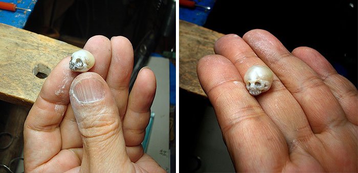 two skull pearls on hand