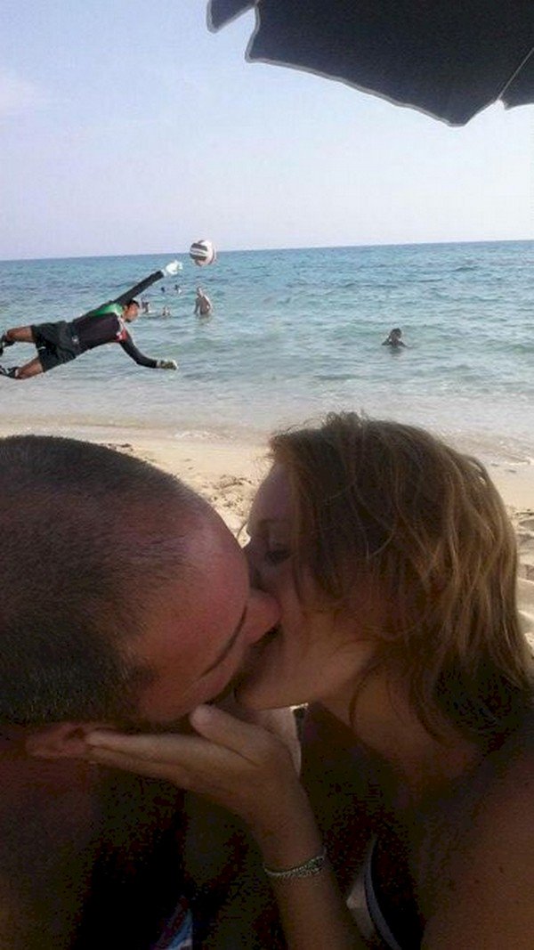 couple kissing goalkeeper