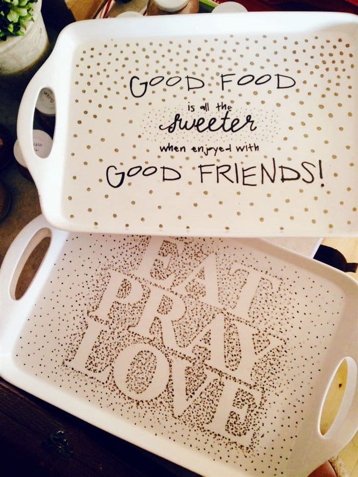 two serving trays with writing on them 