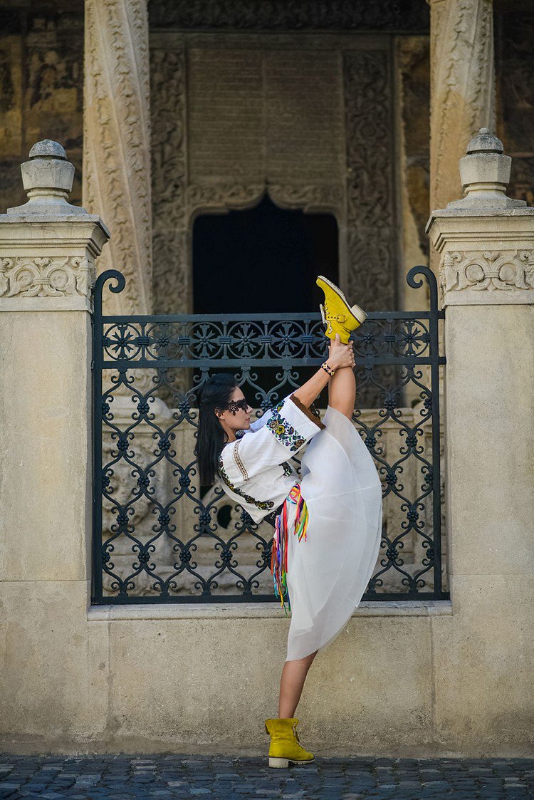 romanian ballerina holding leg