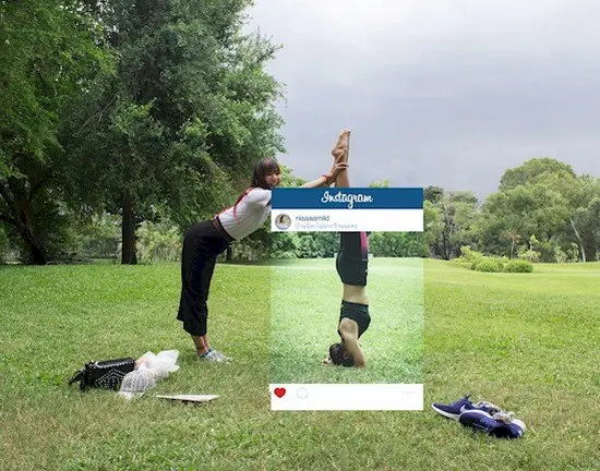 girl holding friend yoga