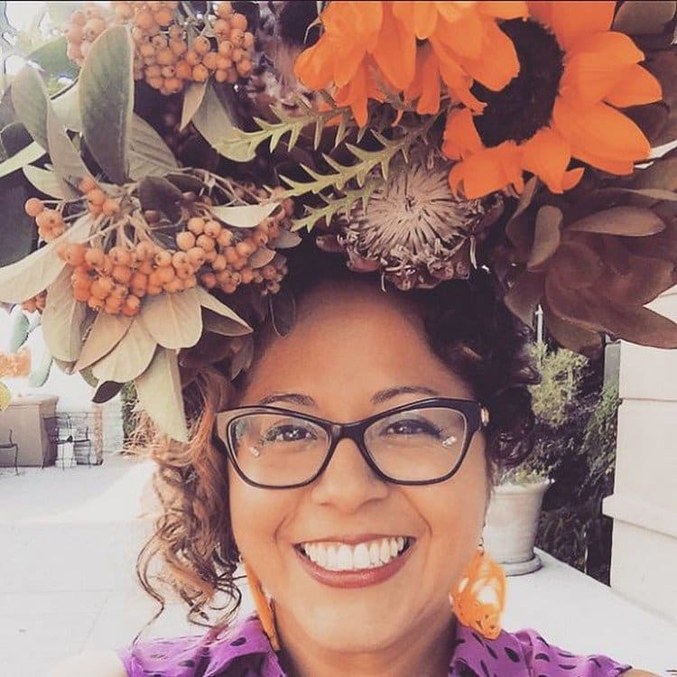 woman orange flowers on head