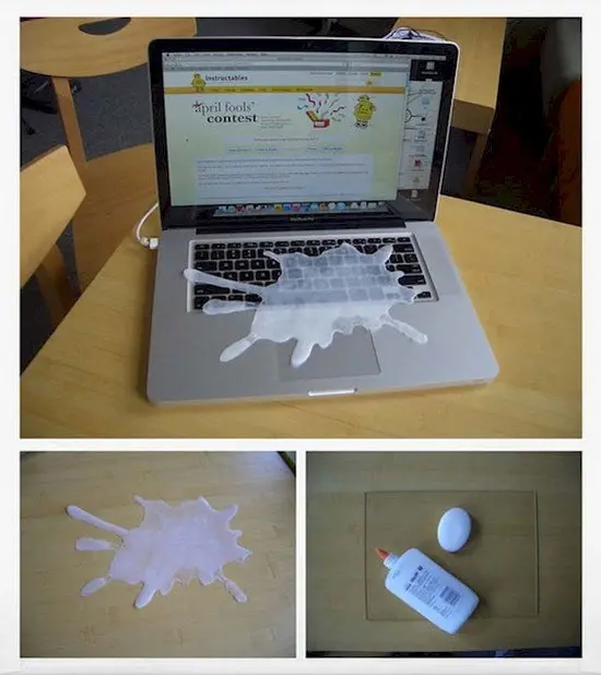 glue splatter over laptop keyboard that looks like spilled milk
