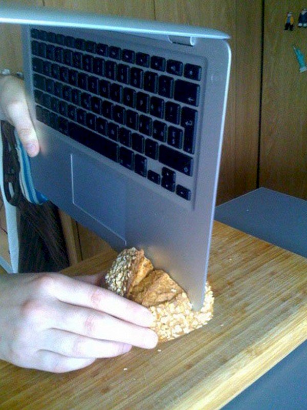 cutting bread with laptop