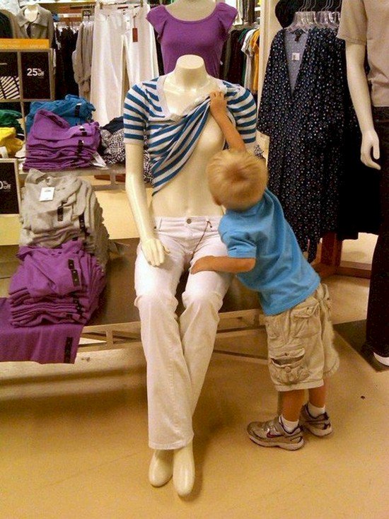 kid lifting mannequin top