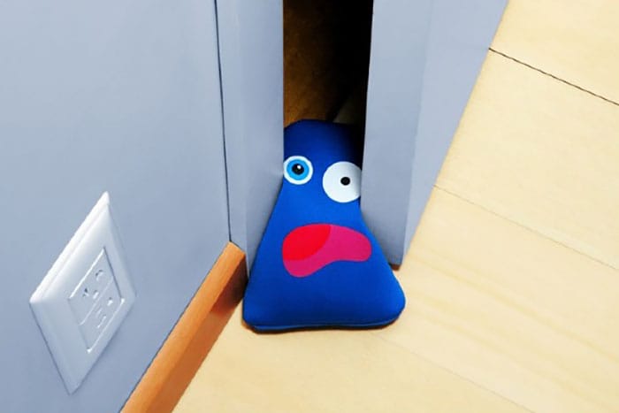 cute squashed figure doorstop