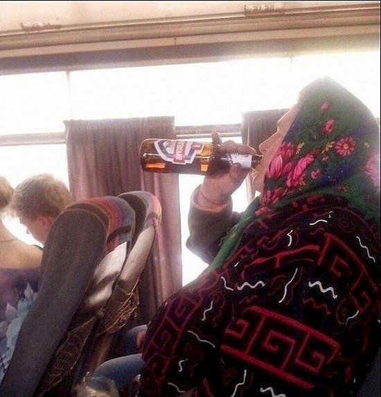 woman drinking on bus