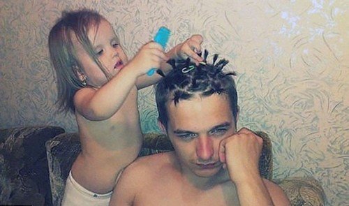 baby doing dads hair