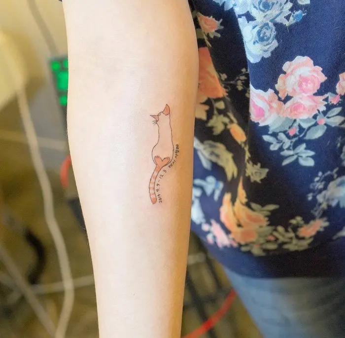 cat arm tattoo