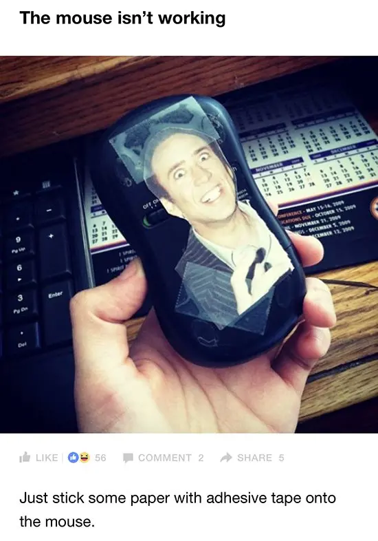 computer mouse with nicolas cage sticker on the bottom
