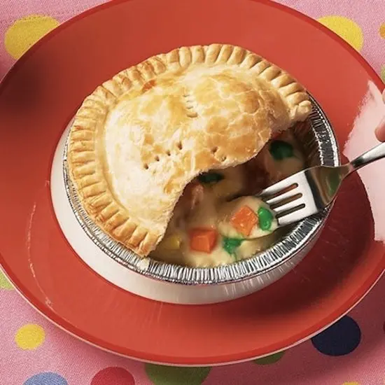 starbursts and skittles pretending to be peas and carrots in a pie 