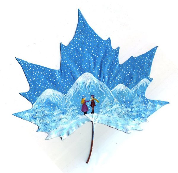 fallen-leaf-art-couple-mountains-snow