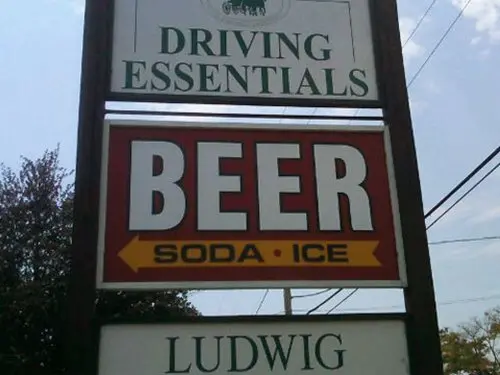 funny-signs-driving-essentials-beer