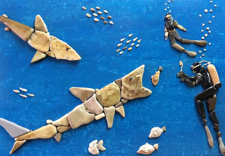 divers-and-shark-stone-art